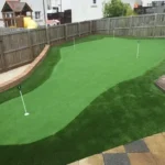 Affordable backyard putting green made with artificial grass, ideal for home golf practice.