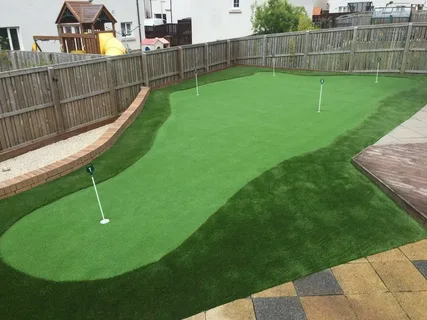 Affordable backyard putting green made with artificial grass, ideal for home golf practice.